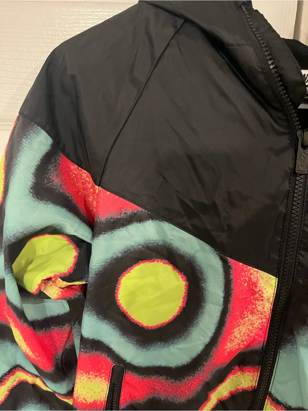 Nike Kids Black Windbreaker with Neon Yellow, Teal & Red Geo Print